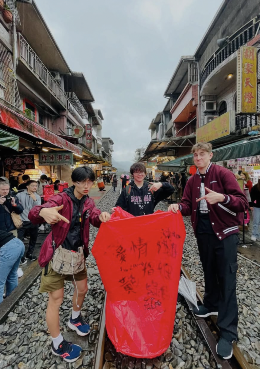 Brandon Lin, Kurtis Williams, and Max Filipov touring Old Shifen Street in New Taipei, Taiwan.